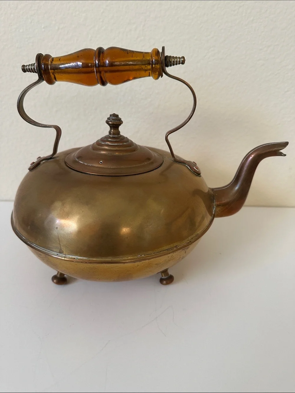 Antique-Inspired Brass Footed Tea Kettle with Amber Glass Handle